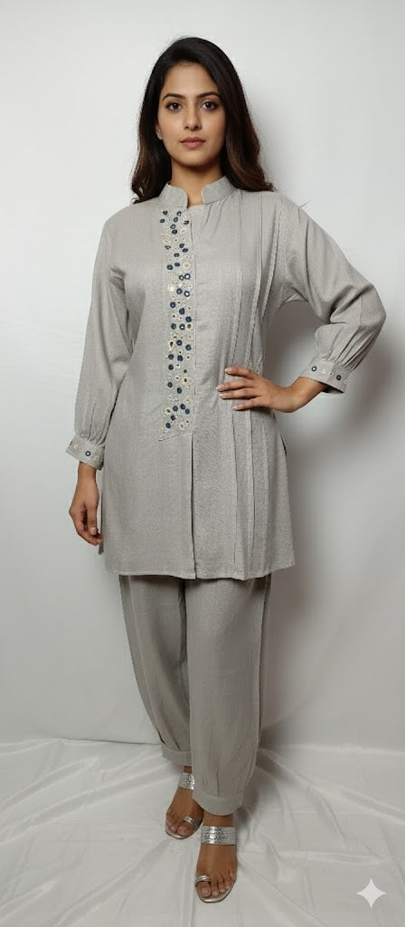 grey-indo-western-coord-set-with-mandarin-collar-and-embroidery

womens-ethnic-grey-tunic-and-pants-set-front-view

detailed-embroidery-on-grey-designer-kurti-placket